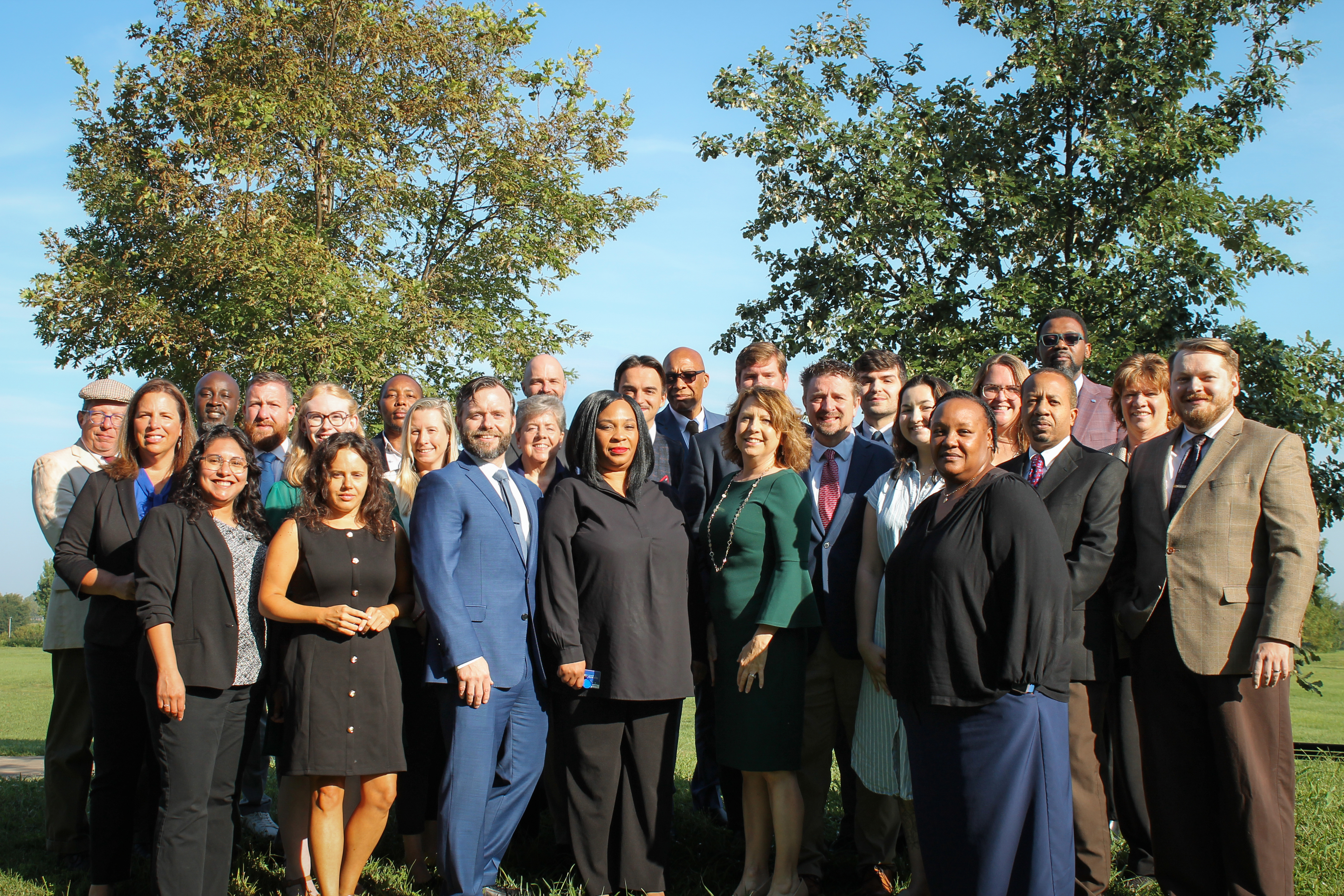 Landscape photo of UK Internal Audit's staff with trees in the background